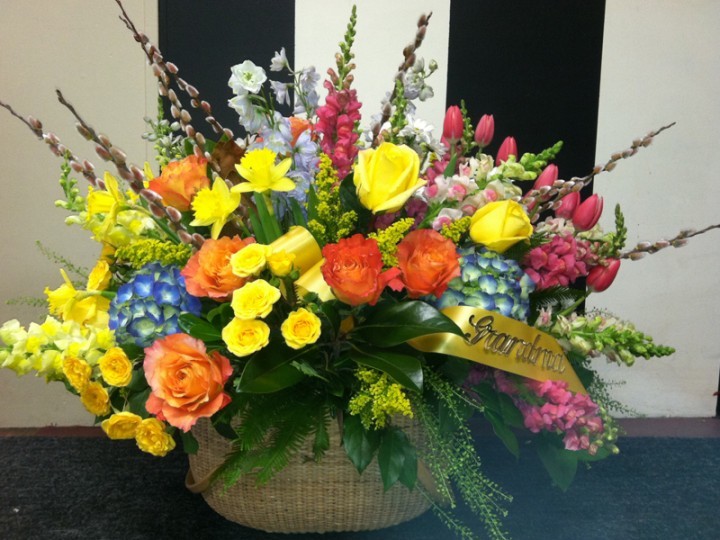 Red and yellow funeral floral arrangement