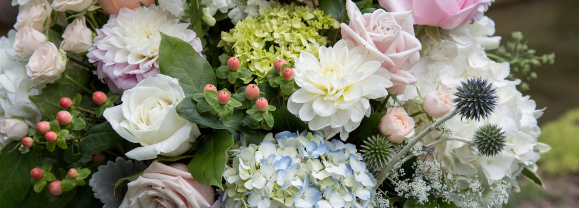 Floral arrangement of soft colored flowers