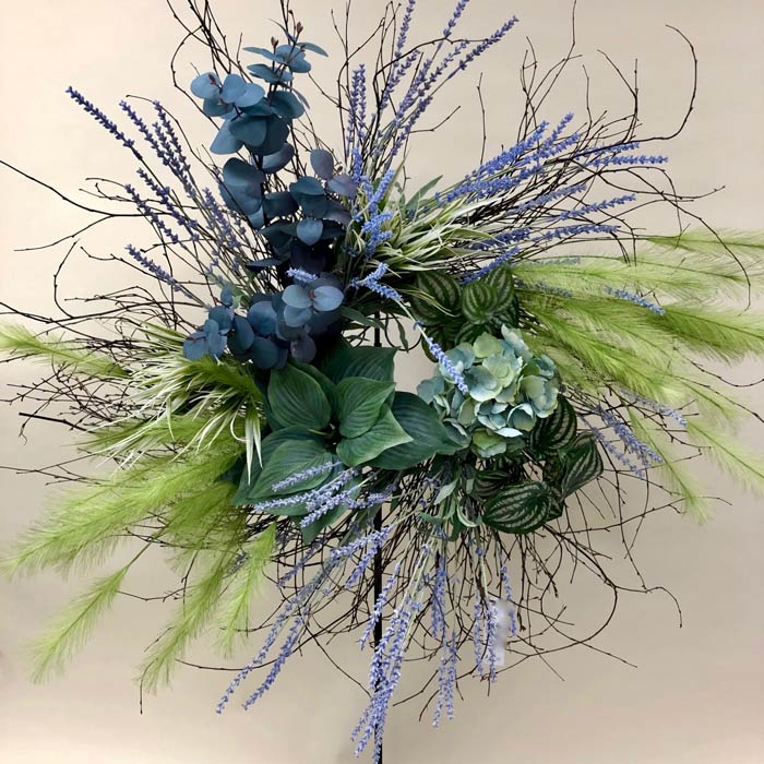 Wreath with delicate silk greens and flowers