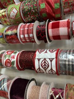 Spools of holiday ribbon in festive colors